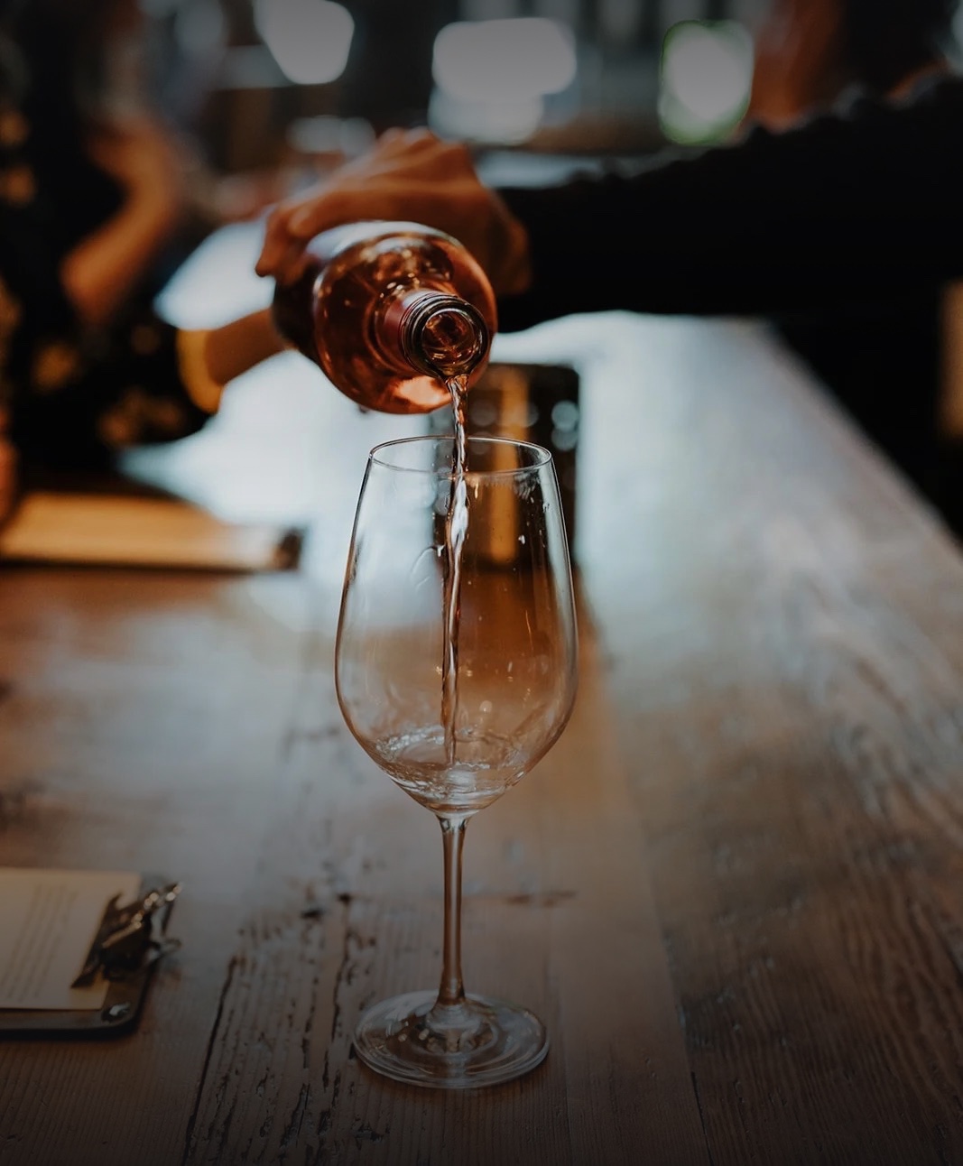 Wine being poured into a glass at ENSO