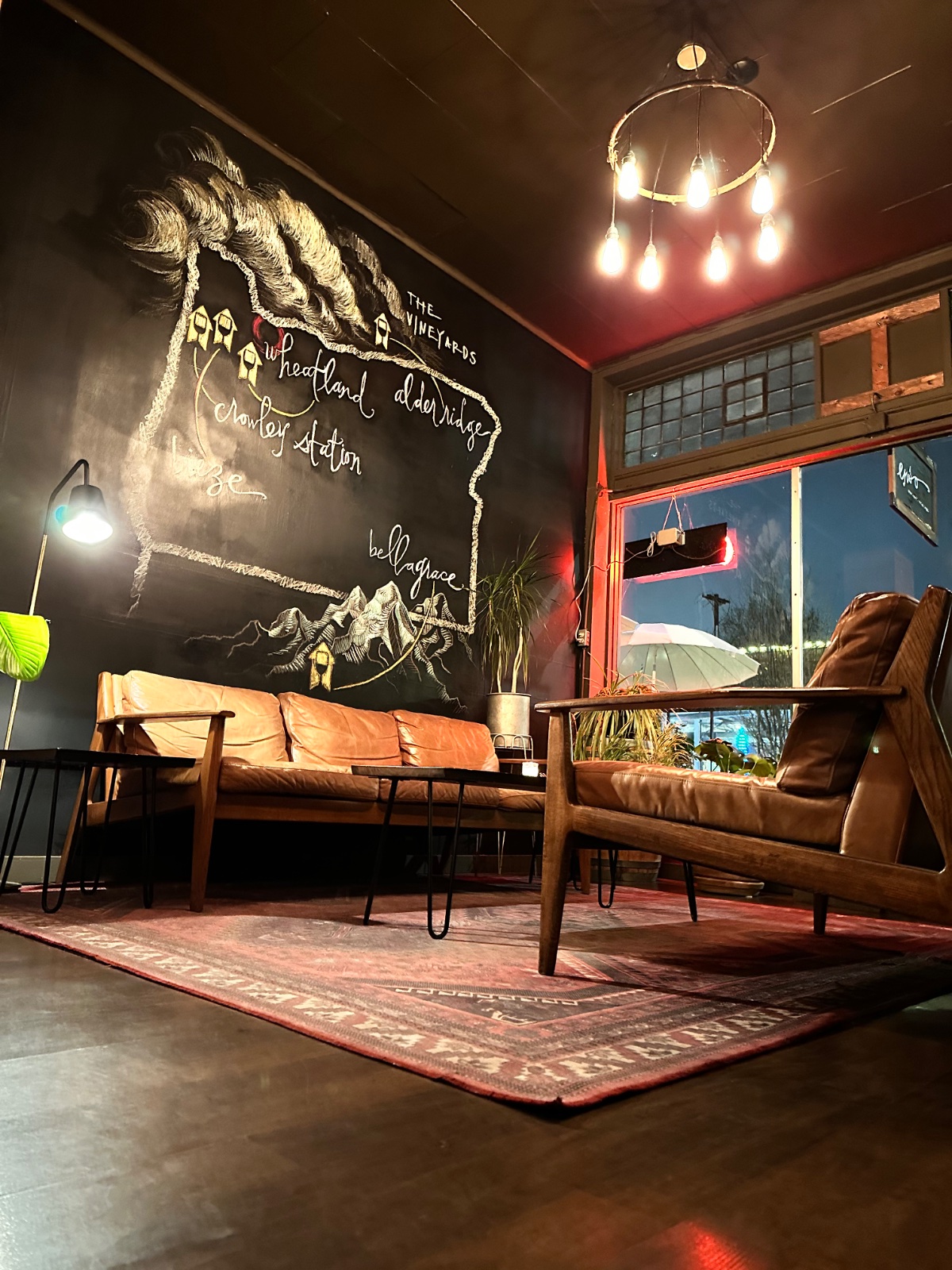 The hand-drawn chalkboard map of ENSO's vineyards above the leather sofas in the lounge