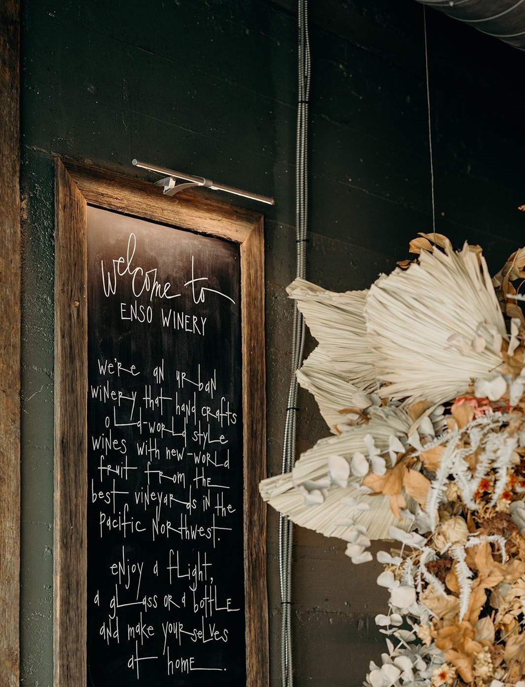 Hand-lettered Welcome to ENSO Winery chalkboard